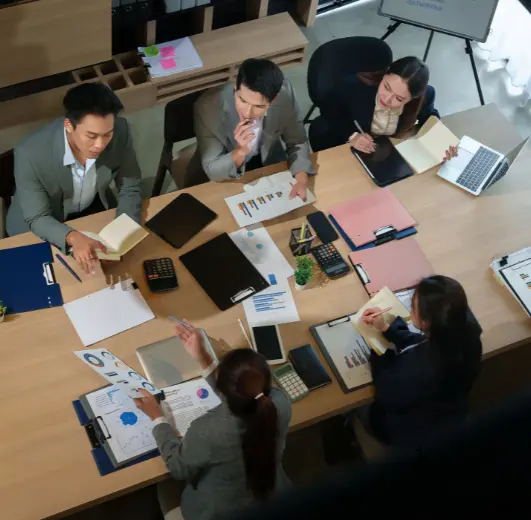 Finance professionals reviewing business reports and financial controls